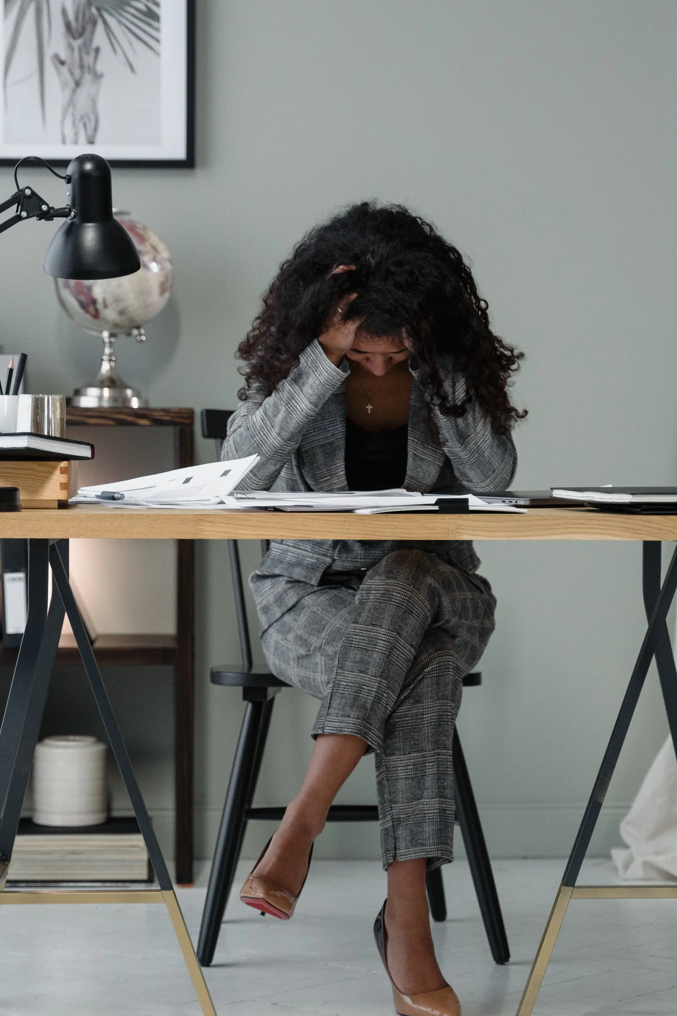 Frustrated business owner reviewing paperwork